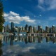 city skyline across body of water - photo by masaru suzuki