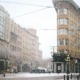 concrete road beside building during winter season - photo by elora manzo