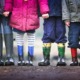 four children standing on dirt during daytime - photo by ben wicks