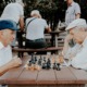two men playing chess - photo by vlad sargu