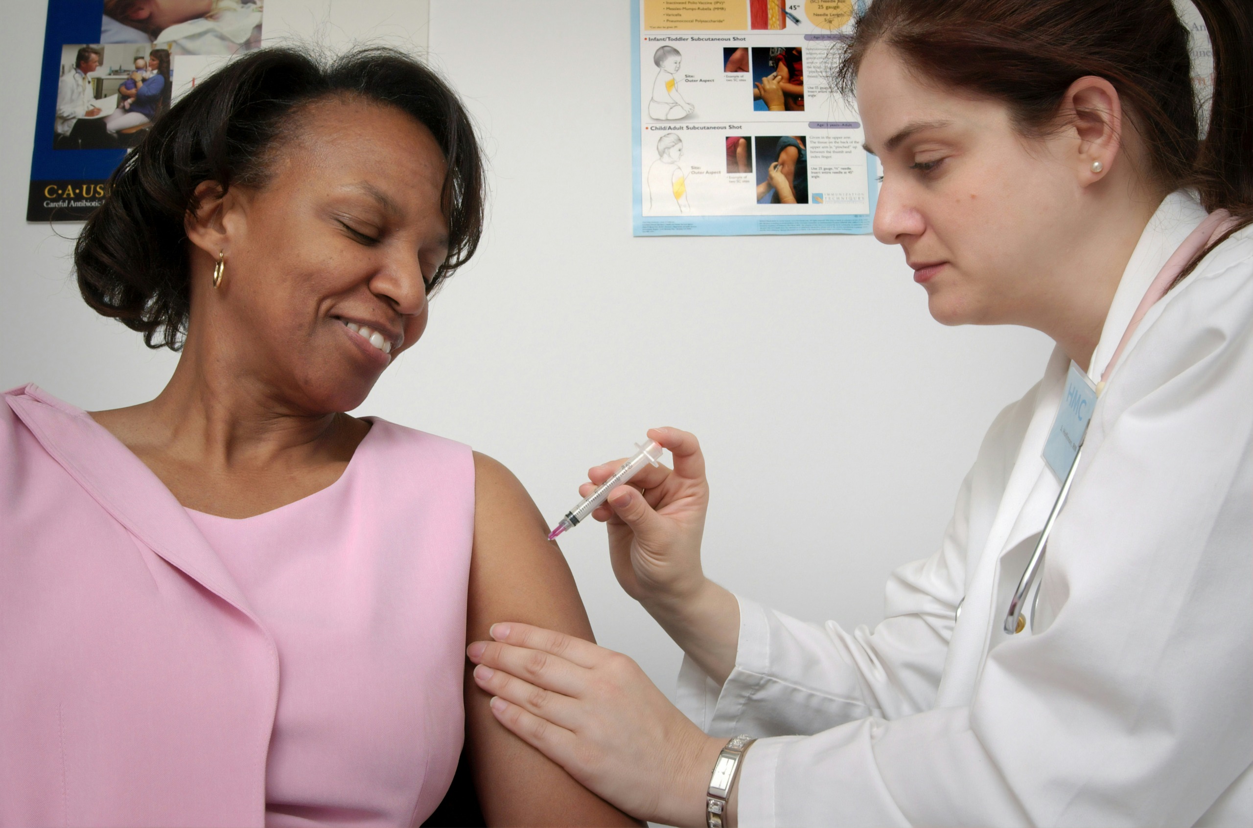 woman getting vaccinated - photo by cdc